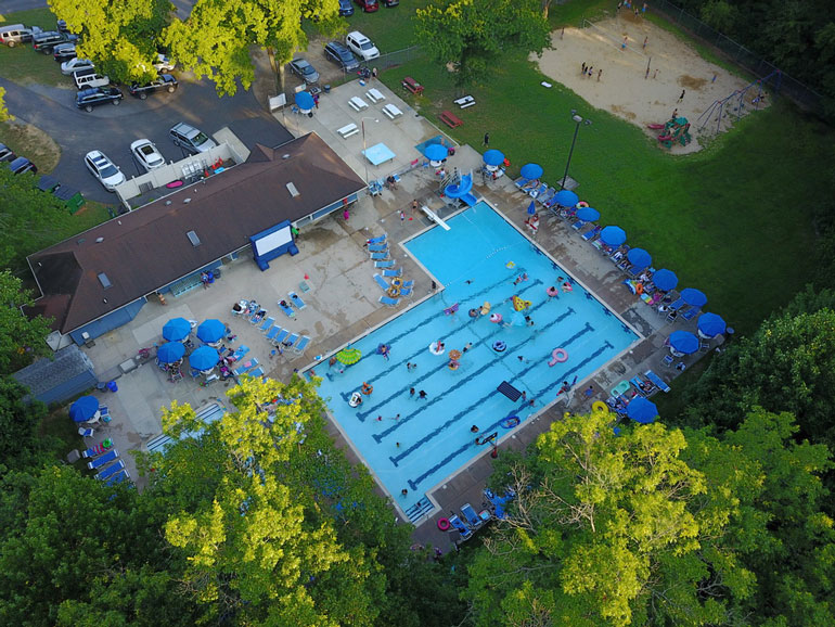 Drone-Image Drone image of Fair Blue Swim Club in the afternoon looking down at the pool and grounds