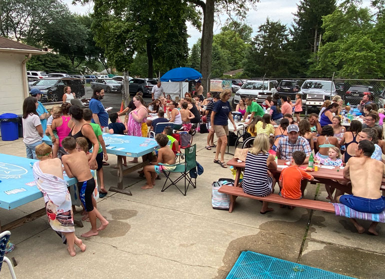 Snackbar Crowd of people at the snack bar and on the pavilion at Fair Blue Swim Club